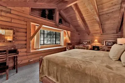a bedroom with a bed in a log cabin at Woodland log #1887 in Big Bear Lake