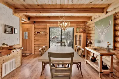 a dining room with a table and chairs at Woodland log #1887 in Big Bear Lake