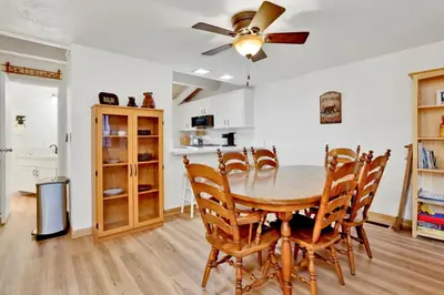 a kitchen and dining room with a table and chairs at Chairlift lodge#2354 in Big Bear Lake