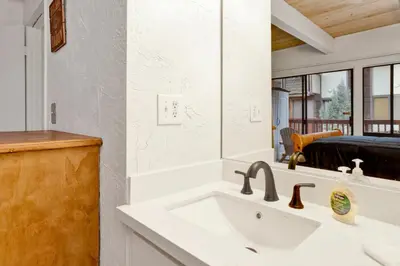 a bathroom with a sink and a mirror at Chairlift lodge#2354 in Big Bear Lake