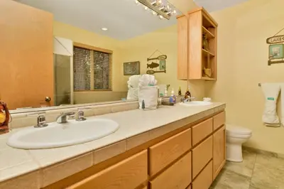 a bathroom with a sink and a toilet and a mirror at CAN'T BEAR TO LEAVE #1156 in Big Bear Lake