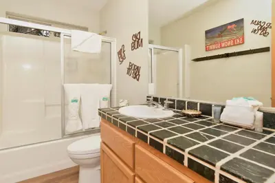a bathroom with a sink and a toilet and a shower at CAN'T BEAR TO LEAVE #1156 in Big Bear Lake