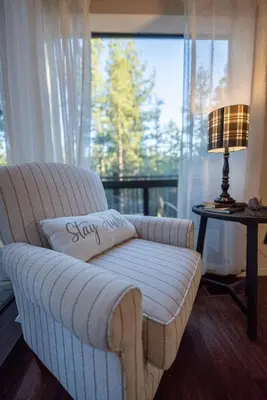 a white couch in a living room with a window at Soaring pines #2193 in Big Bear Lake