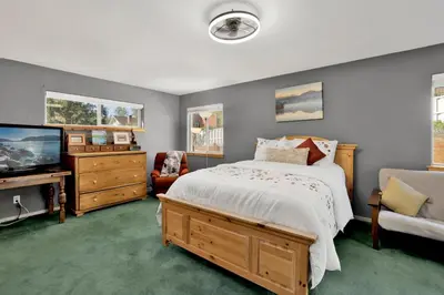 a bedroom with a bed and a flat screen tv at River rock lodge #1953 in Big Bear Lake