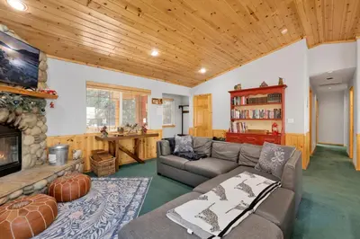 a living room with a couch and a fireplace at River rock lodge #1953 in Big Bear Lake