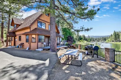 a house with a picnic table and a grill at Breezy one #112 in Big Bear Lake