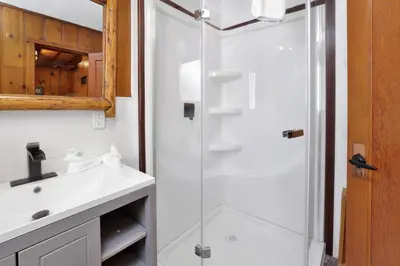 a bathroom with a shower and a sink at Little pines #102 in Big Bear Lake
