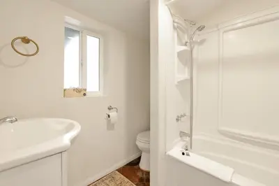 a white bathroom with a sink and a toilet at The weekender #2342 in Big Bear City