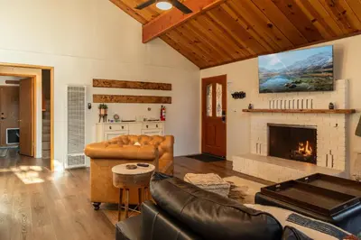 a living room with a couch and a fireplace at The lost compass #2165 in Big Bear Lake