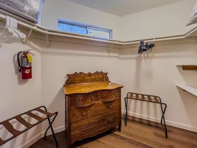a room with a wooden dresser and a fire hydrant at The lost compass #2165 in Big Bear Lake
