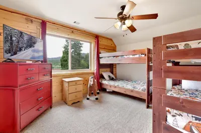a bedroom with two bunk beds and a ceiling fan at Eagle ridge views #1648 in Big Bear Lake