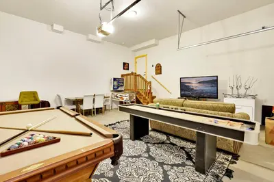 a living room with two pool tables and a couch at Eagle ridge views #1648 in Big Bear Lake