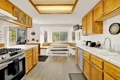 a kitchen with wooden cabinets and a counter top at Divine chateau #2357 in Big Bear Lake