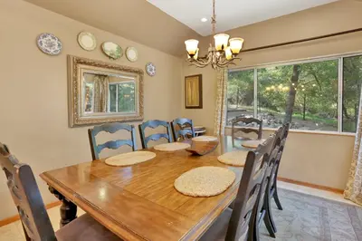 a dining room with a wooden table and chairs at Knickerbocker retreat #2321 in Big Bear Lake