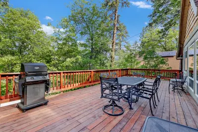a patio with a grill and a table on a deck at Knickerbocker retreat #2321 in Big Bear Lake