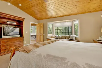 a bedroom with a large bed and a tv at Knickerbocker retreat #2321 in Big Bear Lake