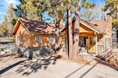 a small house with trees in front of it at Lake shore #012 in Big Bear Lake