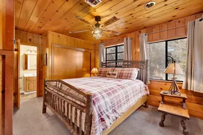 a bedroom with a bed and a wooden ceiling at Lake shore #012 in Big Bear Lake