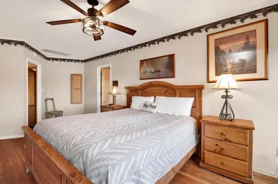 a bedroom with a bed and a ceiling fan at Lake shore #012 in Big Bear Lake