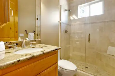 a bathroom with a shower and a sink and a toilet at Sunset ridge villa #2178 in Big Bear Lake
