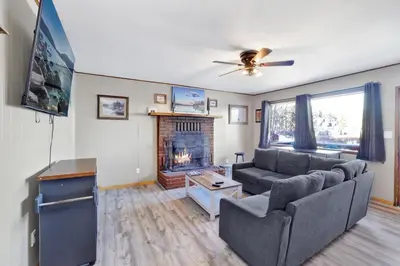 a living room with a couch and a fireplace at Lakefront #110 in Big Bear Lake