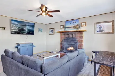 a living room with a couch and a fireplace at Lakefront #110 in Big Bear Lake