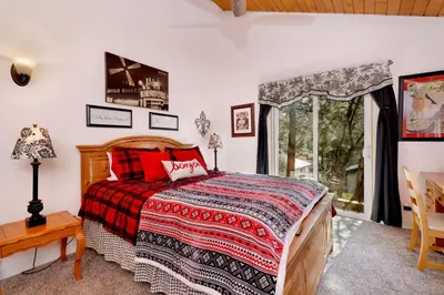 a bedroom with a bed and a window at Moulin rouge #2055 in Big Bear Lake