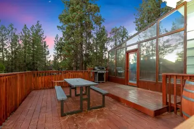 a deck with a picnic table and a grill at Mountain fun #1729 in Big Bear Lake