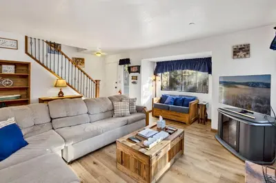 a living room with a couch and a television at Ski time getaway #1848 in Big Bear Lake