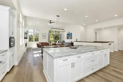 a kitchen with white cabinets and a large island at The pines retreat #2336 in Big Bear Lake