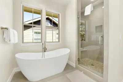a white bathroom with a tub and a shower at The pines retreat #2336 in Big Bear Lake