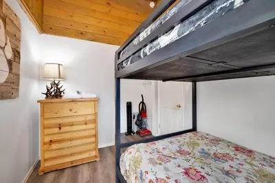 a bedroom with a bunk bed and a wooden ceiling at Storyville #2294 in Big Bear Lake