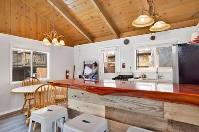 a kitchen with a counter and a table and chairs at Storyville #2294 in Big Bear Lake