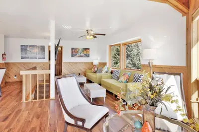 a living room with a couch and a table at The octagon #2394 in Big Bear City