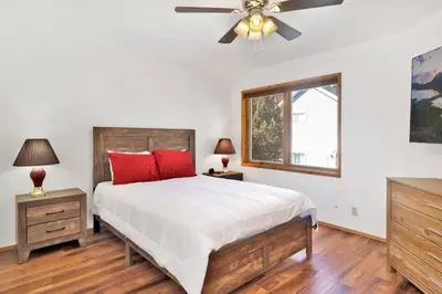 a bedroom with a bed and a ceiling fan at The octagon #2394 in Big Bear City