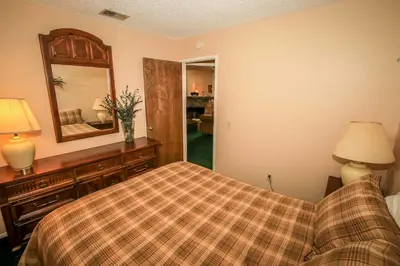 a bedroom with a bed and a mirror at Boulder creek #1412 in Big Bear Lake