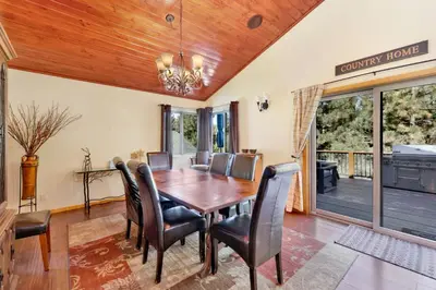 a dining room with a wooden table and chairs at Top Notch Lodge#2056 in Big Bear Lake