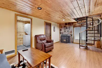 a living room with a chair and a table at Top Notch Lodge#2056 in Big Bear Lake