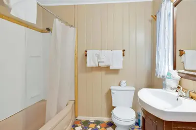 a bathroom with a toilet and a sink at Shore acres lodge #451 in Big Bear Lake