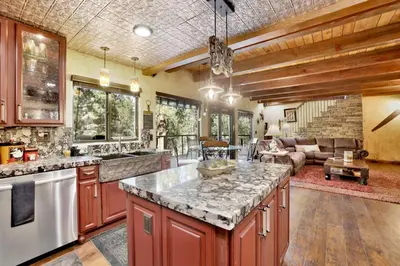 a kitchen with a large island in a room at How sweet it is #1531 in Big Bear Lake