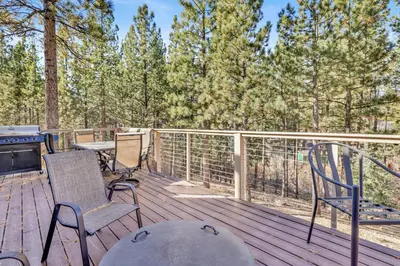 a deck with chairs and a table and a grill at How sweet it is #1531 in Big Bear Lake