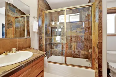 a bathroom with a shower and a sink at Lakefront village castle #2312 in Big Bear Lake