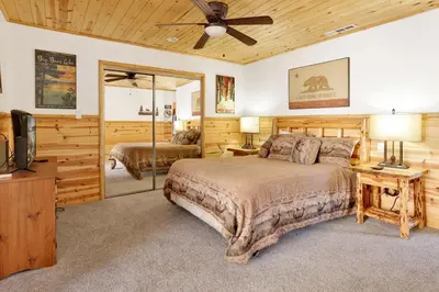 a bedroom with a bed and a ceiling fan at Circle views #1602 in Big Bear Lake
