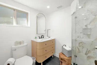 a bathroom with a toilet and a sink and a shower at Vista pines #234 in Big Bear Lake