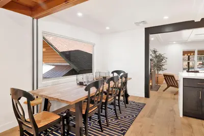 a dining room with a wooden table and chairs at Vista pines #234 in Big Bear Lake