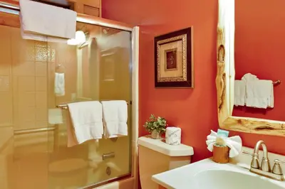 a bathroom with a shower and a toilet and a sink at Knotty and nice #177 in Big Bear Lake