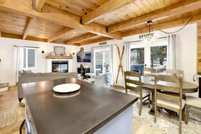a kitchen and living room with a table and chairs at Blue bear chalet #2045 in Big Bear Lake