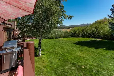 a view of a yard from the balcony of a house at Cienega getaway #1952 in Big Bear Lake