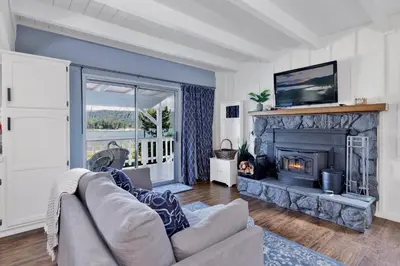 a living room with a couch and a fireplace at North shore chalet #2173 in Fawnskin