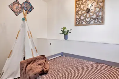 a room with a hammock and a picture on the wall at North shore chalet #2173 in Fawnskin